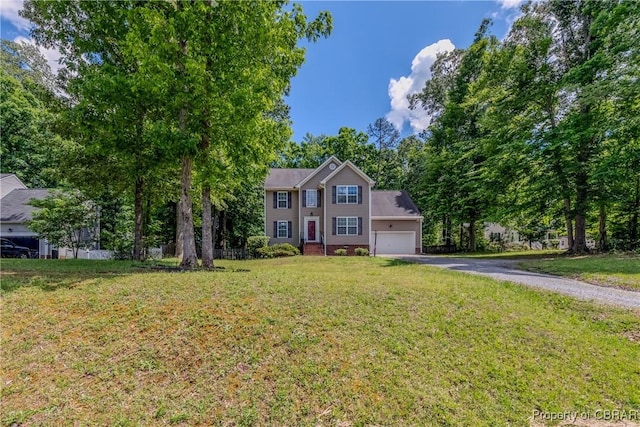 5631 Buckhunt Ln, New Kent, VA 23124 - colonial-style house with asphalt driveway, an attached garage, and a front lawn