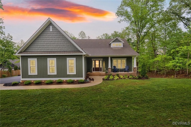 1270 Mill Quarter Rd, Powhatan, VA 23139 - craftsman-style home with a porch, a front yard, roof with shingles, and board and batten siding