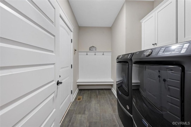 1270 Mill Quarter Rd, Powhatan, VA 23139 - laundry room with cabinet space, washer and dryer, baseboards, and dark wood-style floors