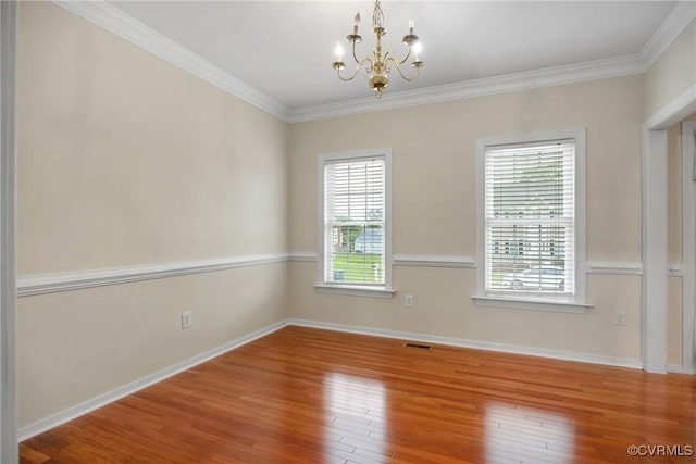 4221 Hunter Green Ct, Henrico, VA 23294 - empty room featuring a chandelier, hardwood / wood-style flooring, crown molding, and baseboards