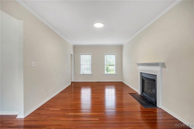 4221 Hunter Green Ct, Henrico, VA 23294 - unfurnished living room featuring wood finished floors, a glass covered fireplace, crown molding, and baseboards