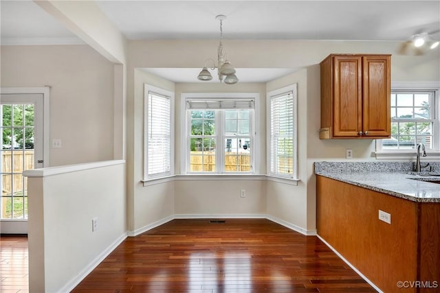 4221 Hunter Green Ct, Henrico, VA 23294 - unfurnished dining area featuring dark wood-style flooring, a chandelier, healthy amount of natural light, and a sink