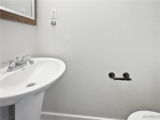 half bathroom with a sink