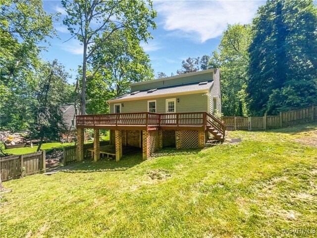 back of property featuring a wooden deck and stairs