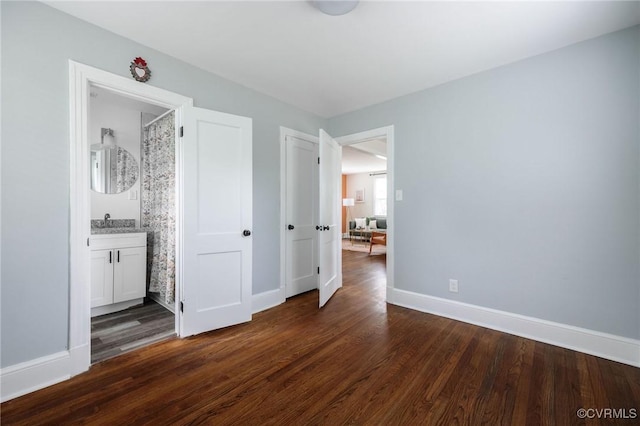 1811 Fenton St, Richmond, VA 23231 - unfurnished bedroom with dark wood-style floors, baseboards, and a sink