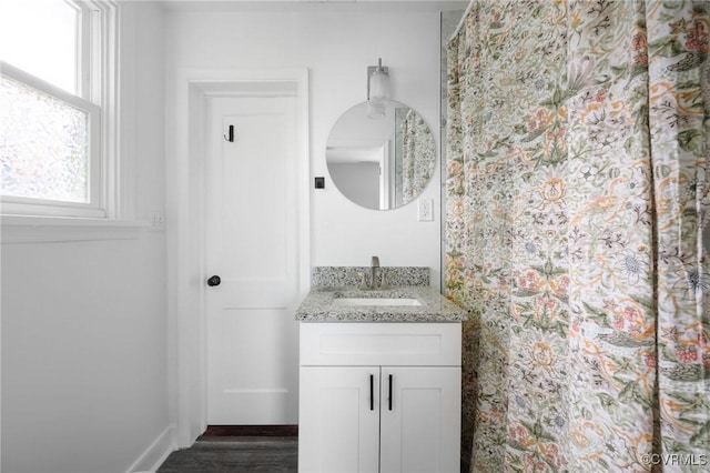 1811 Fenton St, Richmond, VA 23231 - bathroom featuring vanity, baseboards, and wood finished floors