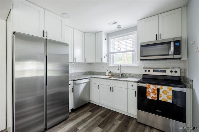 1811 Fenton St, Richmond, VA 23231 - kitchen featuring appliances with stainless steel finishes, a sink, white cabinetry, and dark wood-style flooring