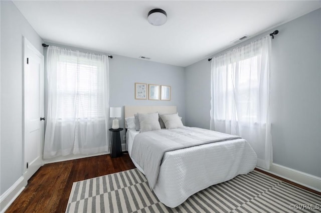 1811 Fenton St, Richmond, VA 23231 - bedroom with multiple windows, wood finished floors, and baseboards
