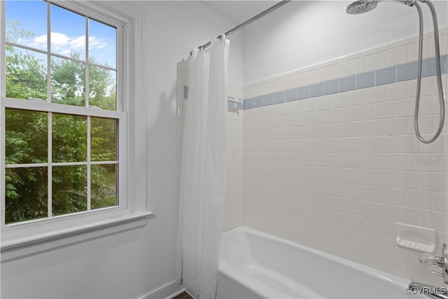 full bathroom featuring shower / bath combo with shower curtain