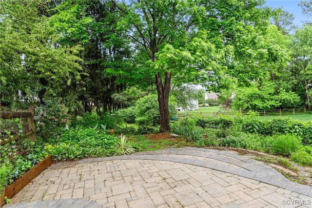view of patio / terrace featuring fence