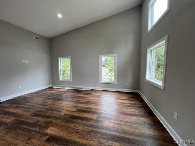 13335 Happy Hill Rd, Chesterfield, VA 23831 - empty room featuring high vaulted ceiling, baseboards, dark wood-style floors, and recessed lighting