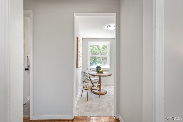 hallway featuring baseboards