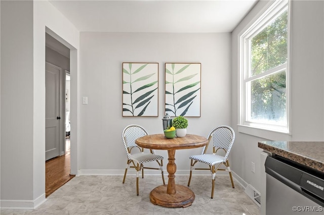 dining room featuring baseboards