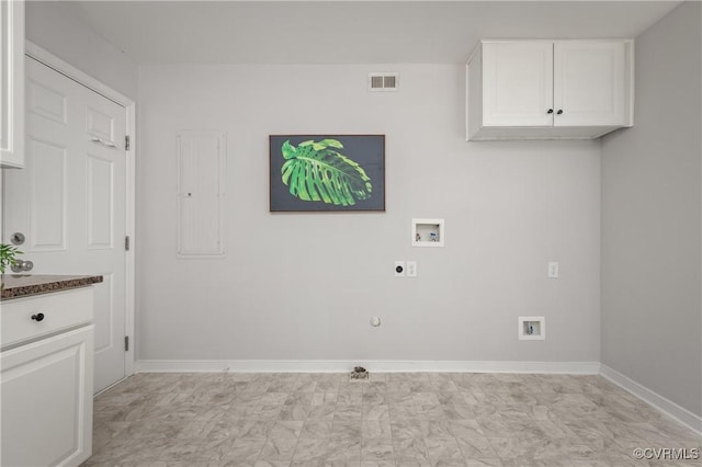 washroom with hookup for an electric dryer, hookup for a washing machine, hookup for a gas dryer, baseboards, and electric panel