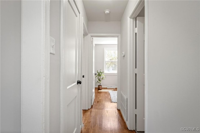 corridor featuring wood finished floors