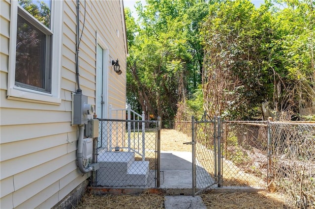 view of property exterior with a gate and fence