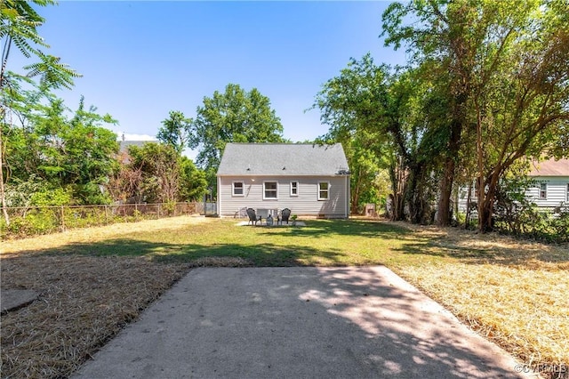 rear view of property featuring a patio