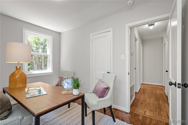 office featuring wood finished floors and baseboards