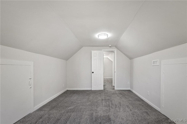 bonus room featuring carpet flooring, vaulted ceiling, and baseboards