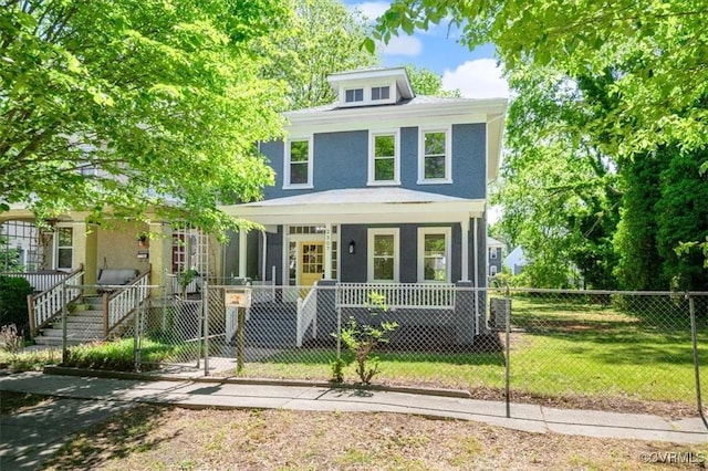 american foursquare style home with a porch, a fenced front yard, and stucco siding