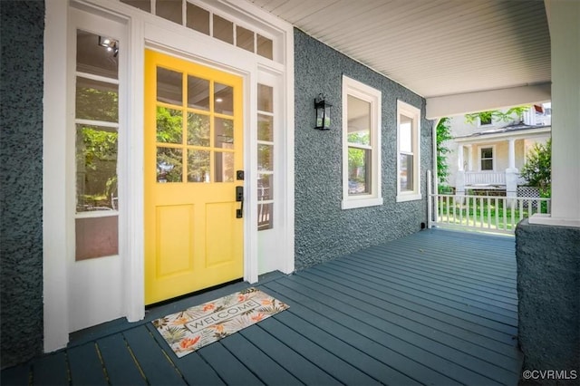 doorway to property with covered porch