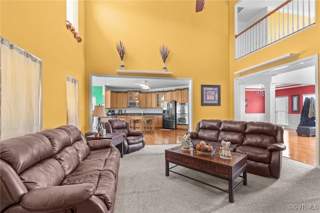 1601 Carty Bay Dr, Chester, VA 23836 - living area featuring a towering ceiling, light wood-type flooring, and ornate columns