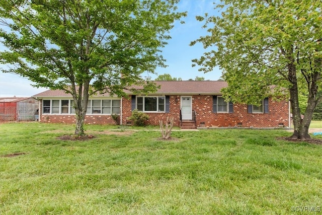 ranch-style house featuring brick siding, a front lawn, and entry steps