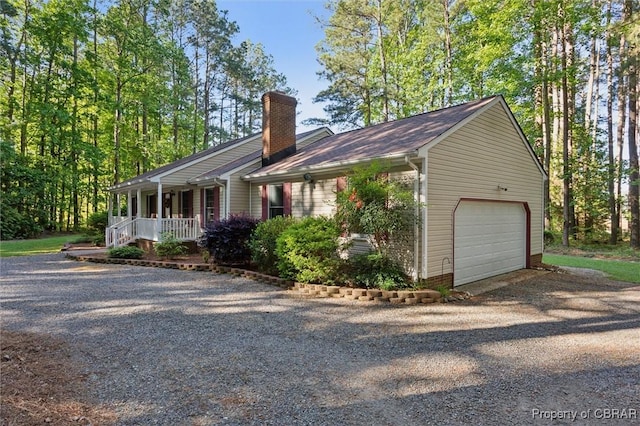 591 Plantation Rd, North, VA 23128 - view of property exterior featuring driveway, a porch, a chimney, and an attached garage