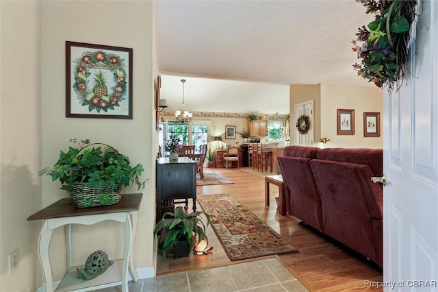591 Plantation Rd, North, VA 23128 - entryway featuring wood finished floors and a chandelier