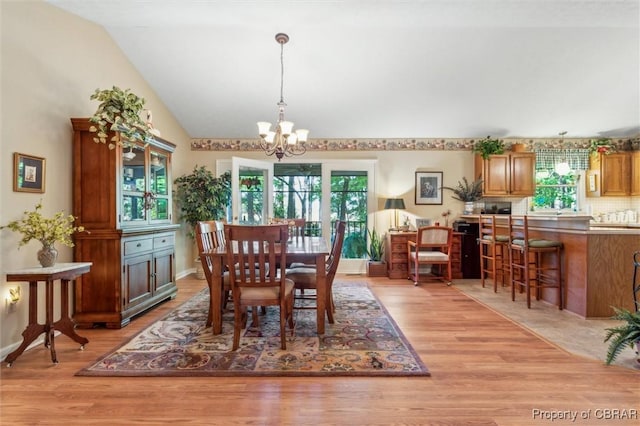 591 Plantation Rd, North, VA 23128 - dining room featuring a chandelier, healthy amount of natural light, light wood-style floors, and lofted ceiling