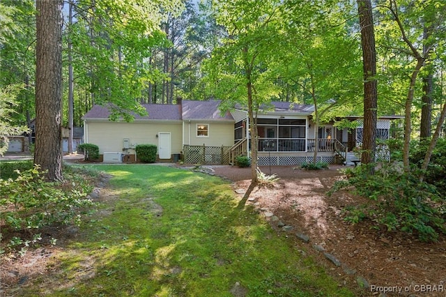 591 Plantation Rd, North, VA 23128 - back of property featuring a sunroom and a lawn