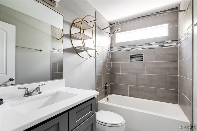 full bathroom with vanity, toilet, and  shower combination