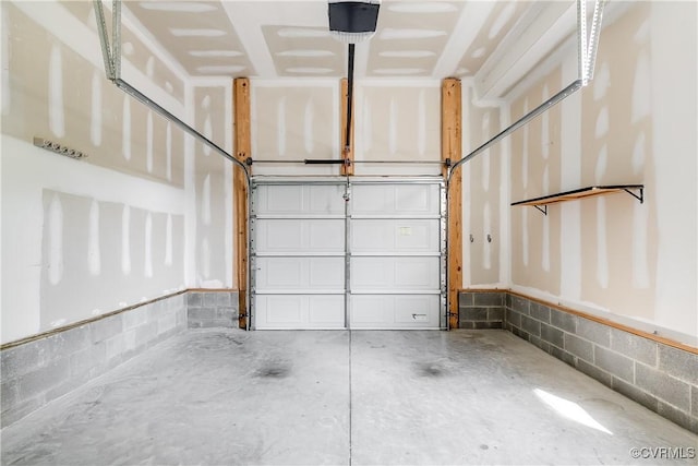 garage with concrete block wall