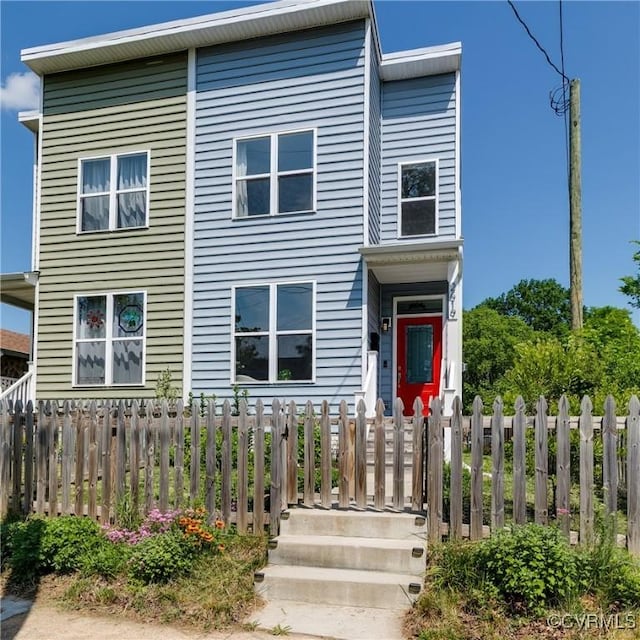 view of front of house with fence