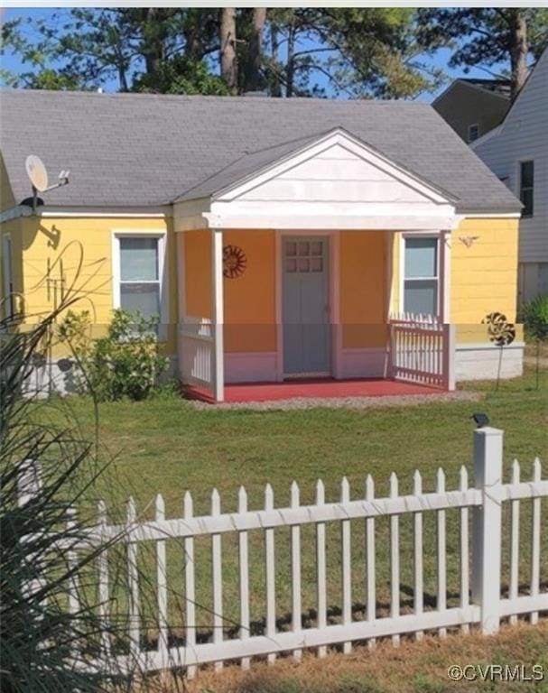 41 Hobday St, Mathews, VA 23128 - bungalow-style house featuring a fenced front yard, a porch, and a shingled roof