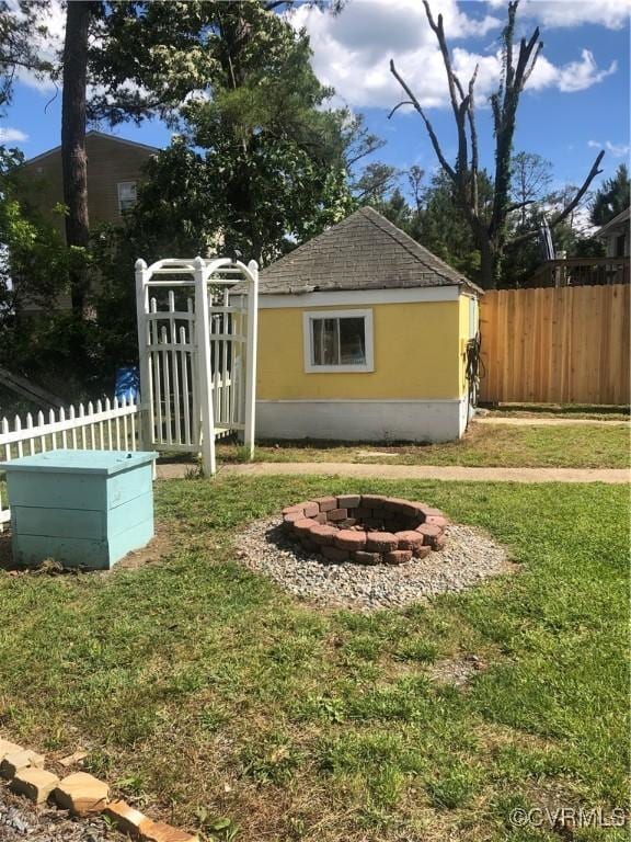 41 Hobday St, Mathews, VA 23128 - view of yard featuring a fire pit and an outdoor structure