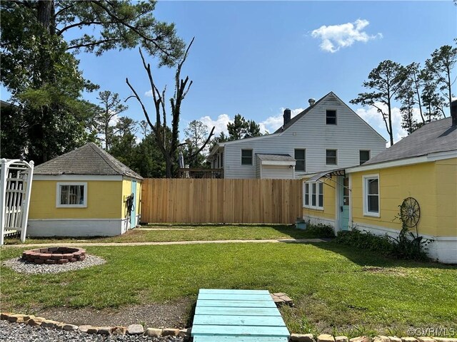 41 Hobday St, Mathews, VA 23128 - view of yard with a fire pit and a storage shed
