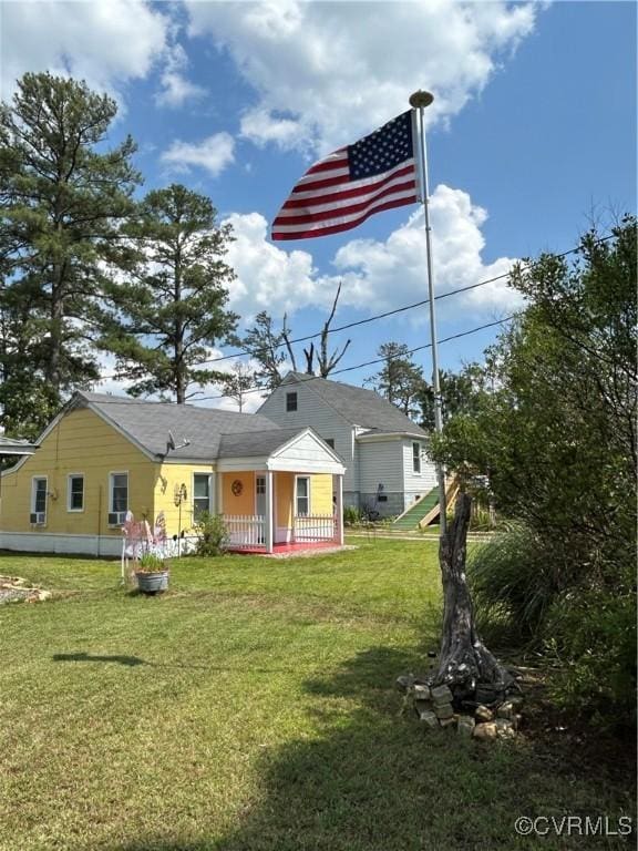 41 Hobday St, Mathews, VA 23128 - back of property featuring a lawn and covered porch