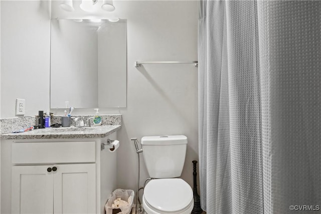 10717 Greenwood Rd, Henrico, VA 23059 - bathroom featuring toilet, vanity, and curtained shower