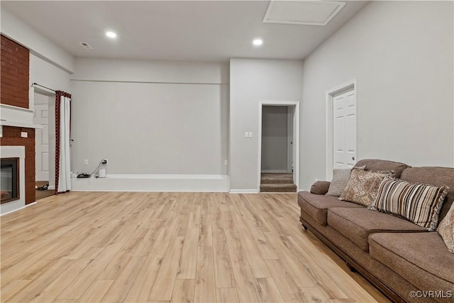 10717 Greenwood Rd, Henrico, VA 23059 - living area with light wood-style floors, recessed lighting, and a fireplace