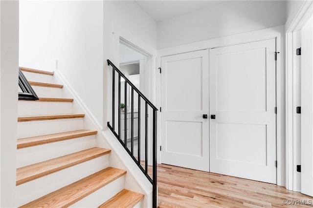 stairs with wood finished floors