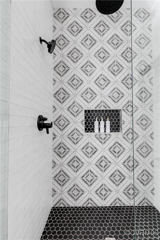 bathroom with tiled shower