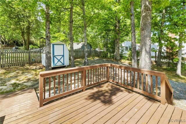9606 Ladue Rd, North Chesterfield, VA 23237 - deck featuring a storage unit, an outbuilding, and a fenced backyard