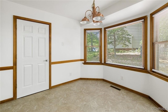 9606 Ladue Rd, North Chesterfield, VA 23237 - unfurnished room with a chandelier, baseboards, and light floors