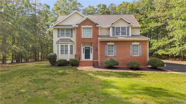 11324 Regalia Dr, Chesterfield, VA 23838 - view of front of home with a front lawn, roof with shingles, and brick siding