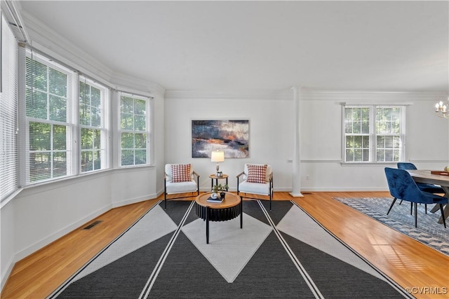11324 Regalia Dr, Chesterfield, VA 23838 - living room with wood finished floors, ornamental molding, a chandelier, and baseboards