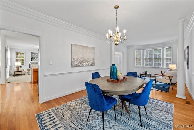 11324 Regalia Dr, Chesterfield, VA 23838 - dining room featuring light wood finished floors, ornamental molding, healthy amount of natural light, and a chandelier