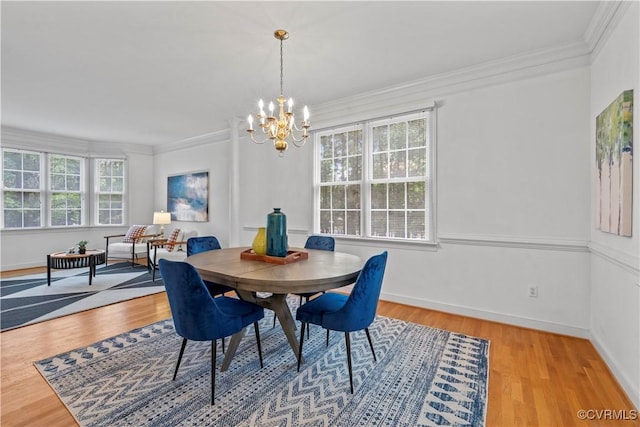 11324 Regalia Dr, Chesterfield, VA 23838 - dining room with healthy amount of natural light, a chandelier, crown molding, wood finished floors, and baseboards
