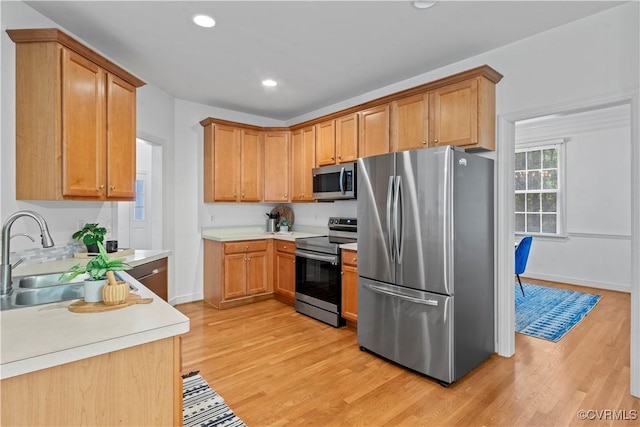 11324 Regalia Dr, Chesterfield, VA 23838 - kitchen with appliances with stainless steel finishes, light wood-style floors, a sink, light countertops, and recessed lighting