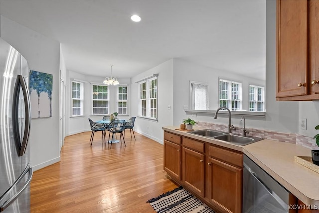 11324 Regalia Dr, Chesterfield, VA 23838 - kitchen featuring appliances with stainless steel finishes, a sink, plenty of natural light, light wood-style floors, and recessed lighting